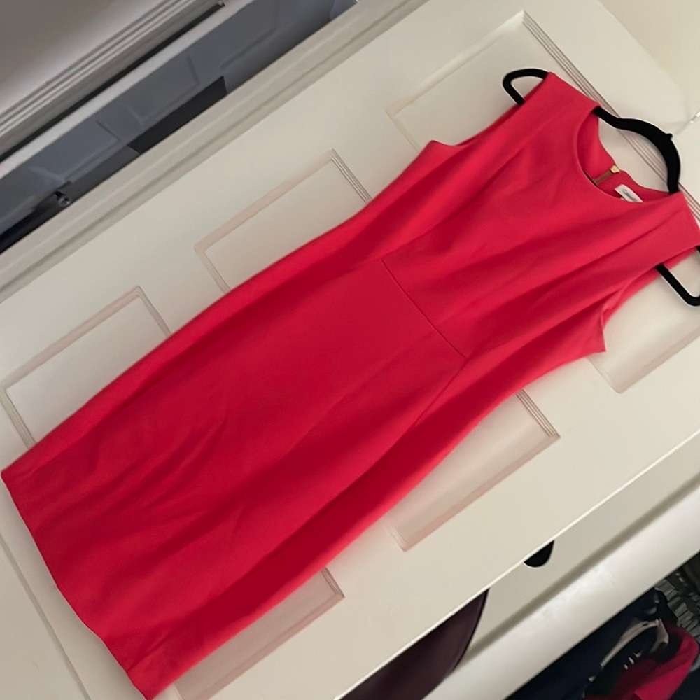 Bright pink Calvin Klein sheath dress size 6 with small hole in the back seam